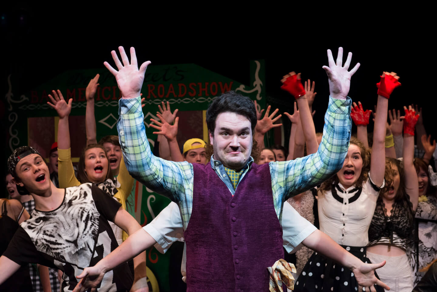 Andrew McTaggart as Dr Ferret and Connect Chorus in Dr Ferret's Bad Medicine Roadshow. Scottish Opera 2015. Credit Richard Campbell. (3).jpg