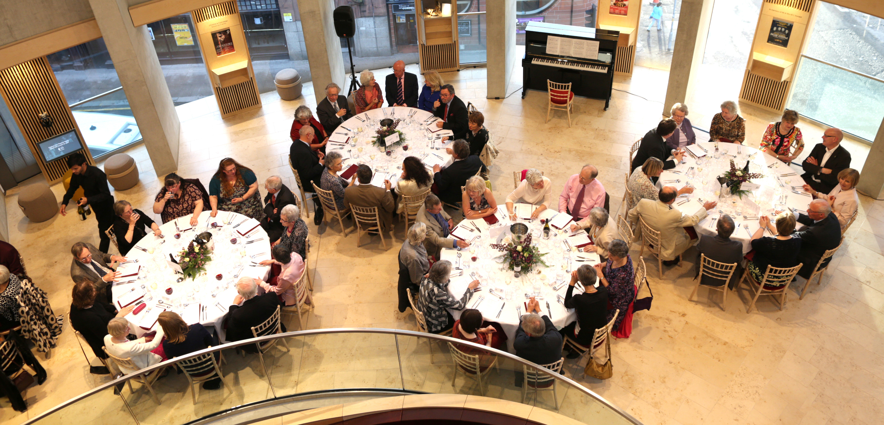 Supporters of Scottish Opera sat around circular banqueting tables at one of Scottish Opera's Supporter events