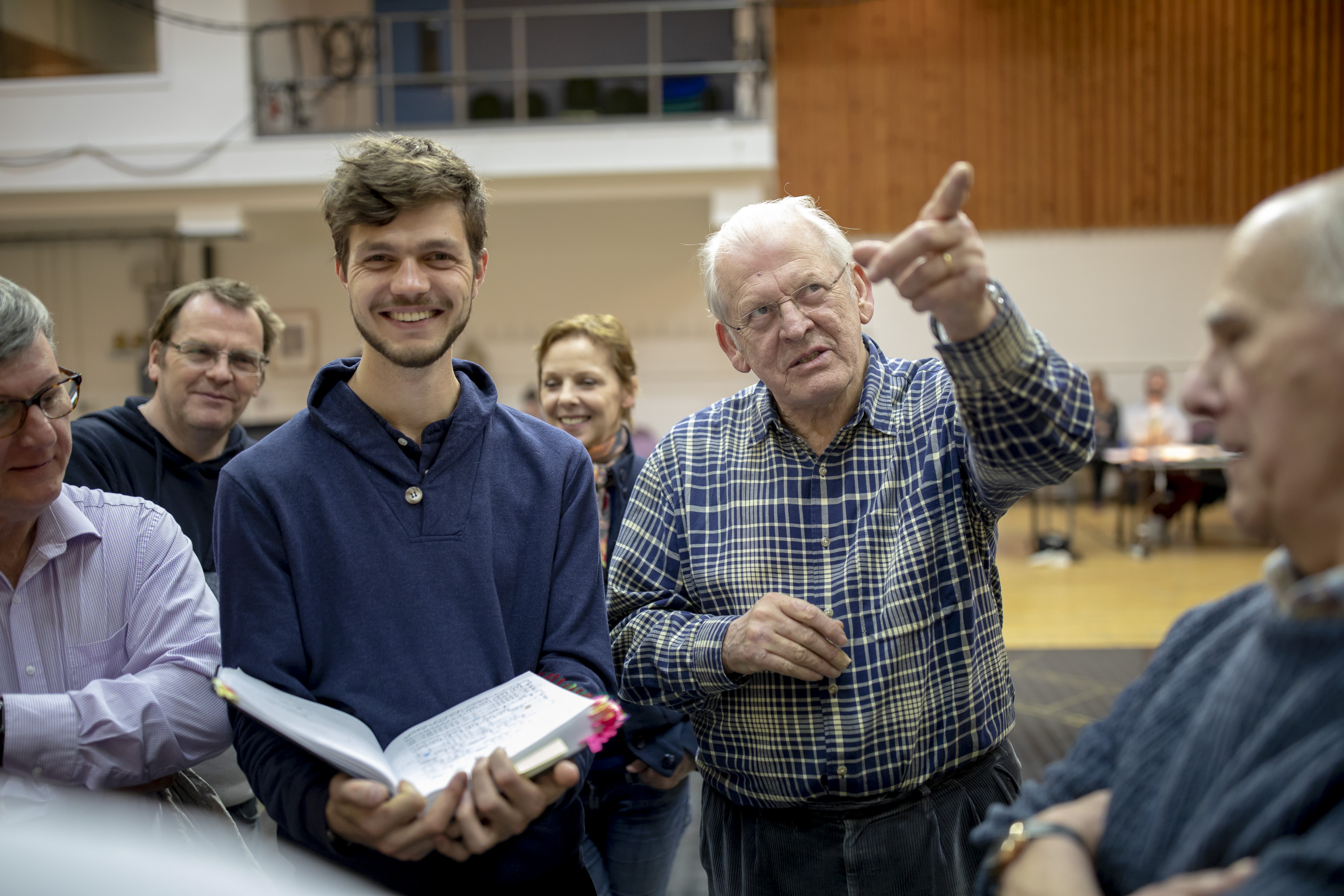 Assistant Director Peter Lorenz, Director Sir Thomas Allen and The Chorus of The Magic Flute in rehearsals. Scottish Opera 2019. Credit James Glossop (1).JPG