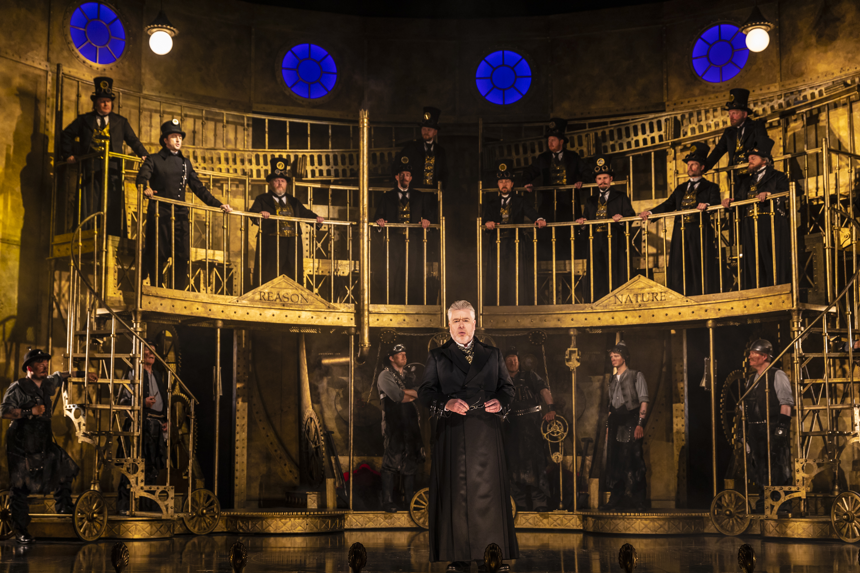 James Creswell (Sarastro) and members of the Chorus in The Magic Flute. Scottish Opera 2019. Credit James Glossop.JPG