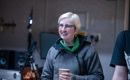 Director Antonia Bain holding a cup of coffee during filming of The Narcissistic Fish
