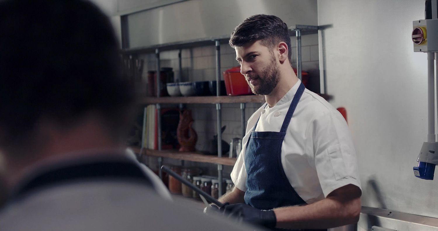 Kai (Mark Nathan) sharpening a knife in The Narcissistic Fish