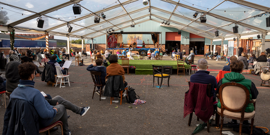 Audience members watching Scottish Opera's outdoor production of La Boheme. Credit James Glossop.