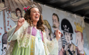Stephanie Stanway in Pop-up Opera, smiling and wearing a purple, green and white princess gown and tiara