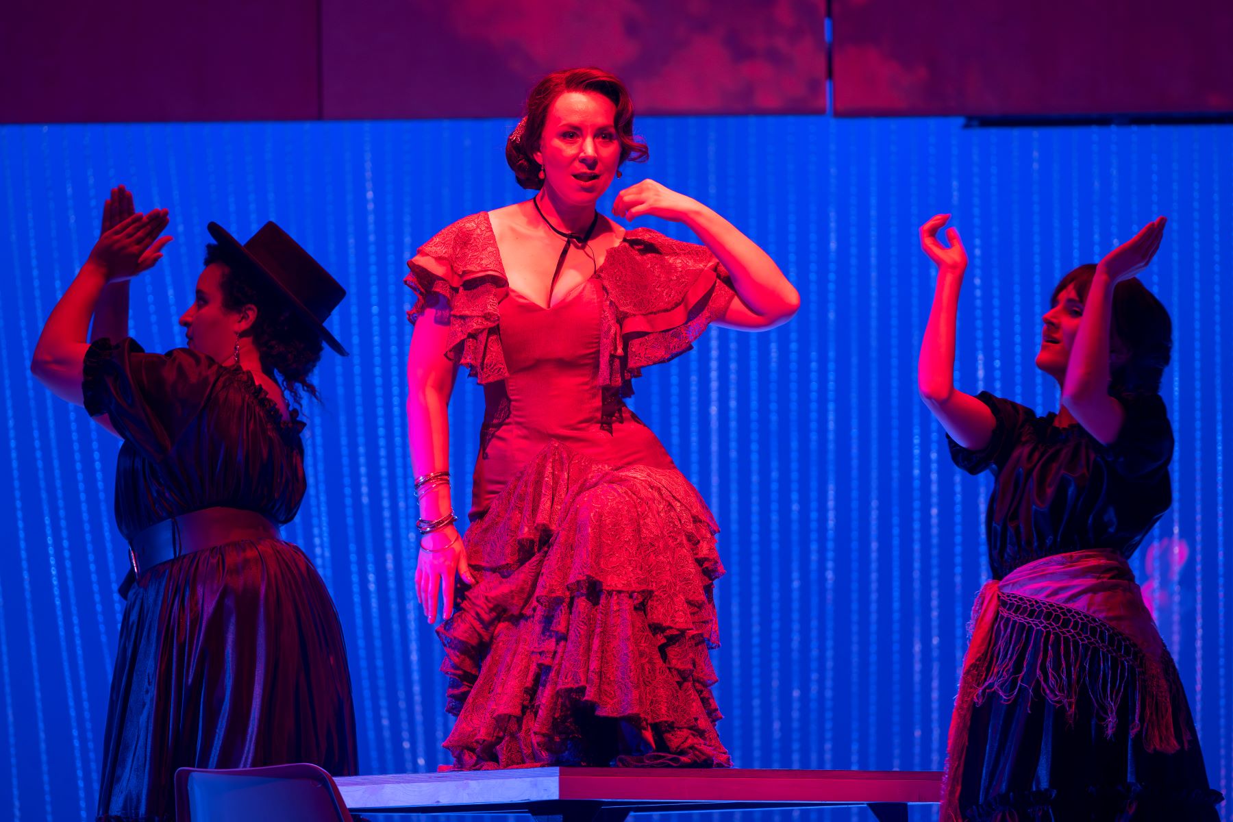 (l to r) Lea Shaw (Mercédès), Justina Gringytė (Carmen) and Zoe Drummond (Frasquita). Scottish Opera 2023. Credit James Glossop