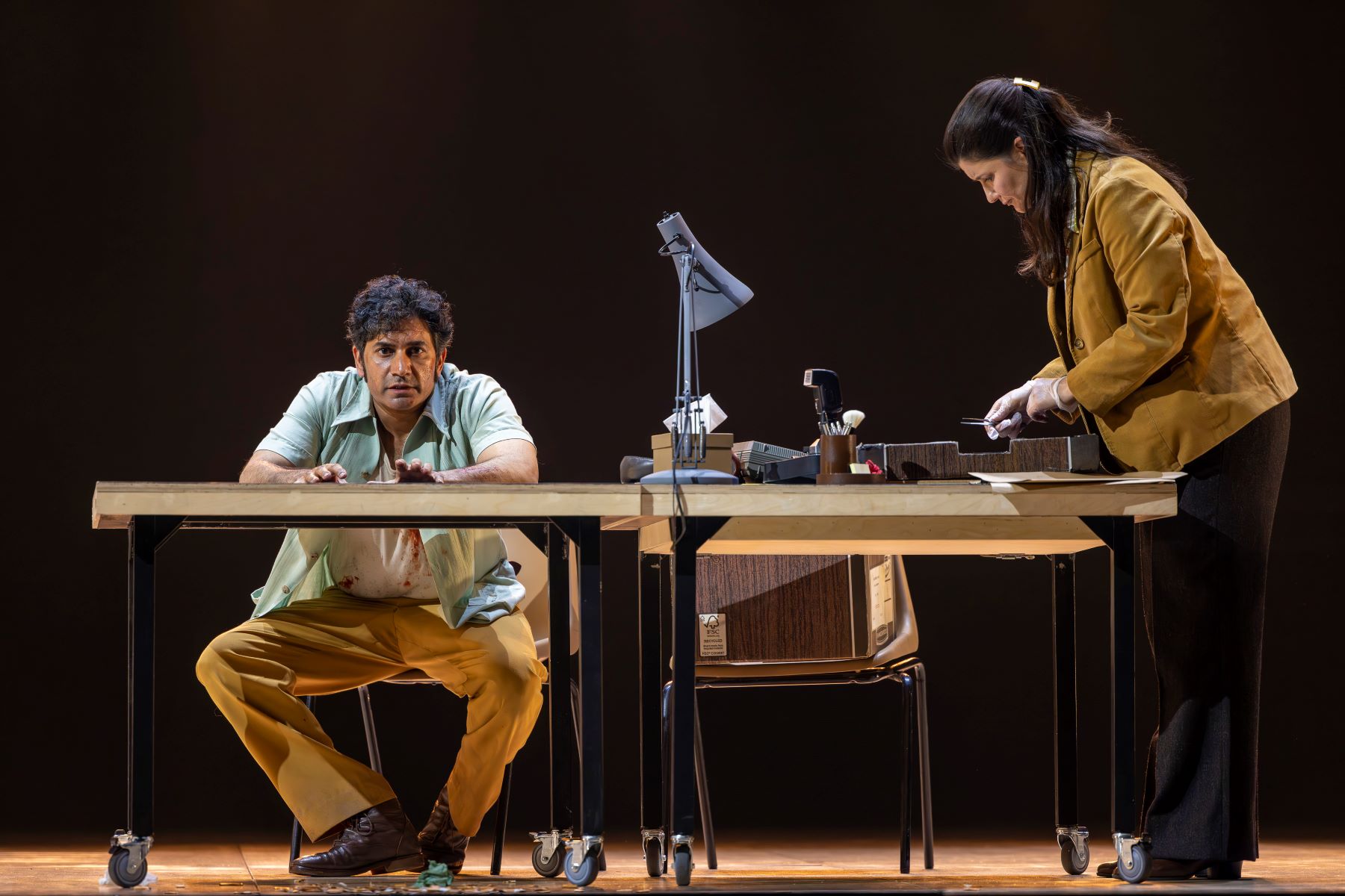 Alok Kumar (Don José) and Carmen Pieraccini (Investigator) in Carmen. Scottish Opera 2023. Credit James Glossop.