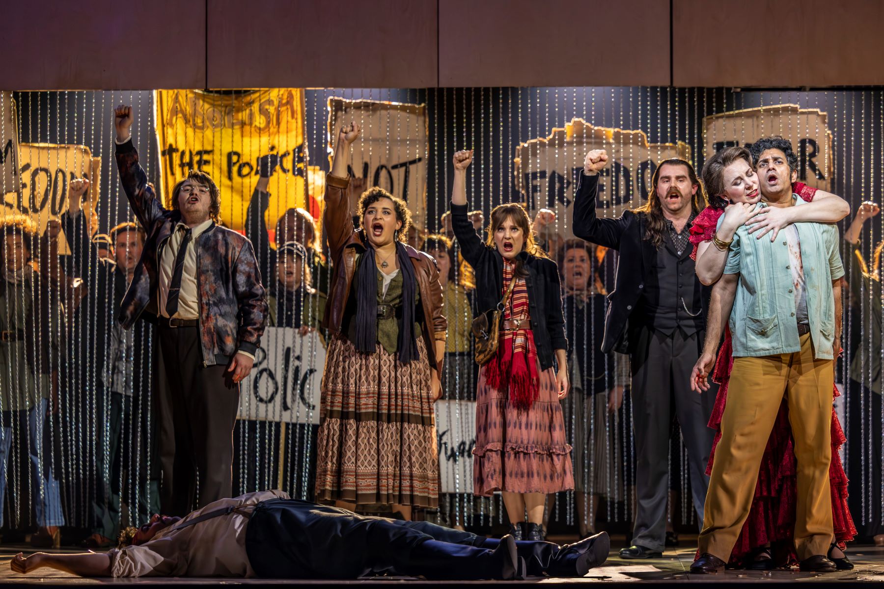 Justina Gringytė (Carmen) and Alok Kumar (Don José) with the cast of Carmen. Scottish Opera 2023. Credit James Glossop.