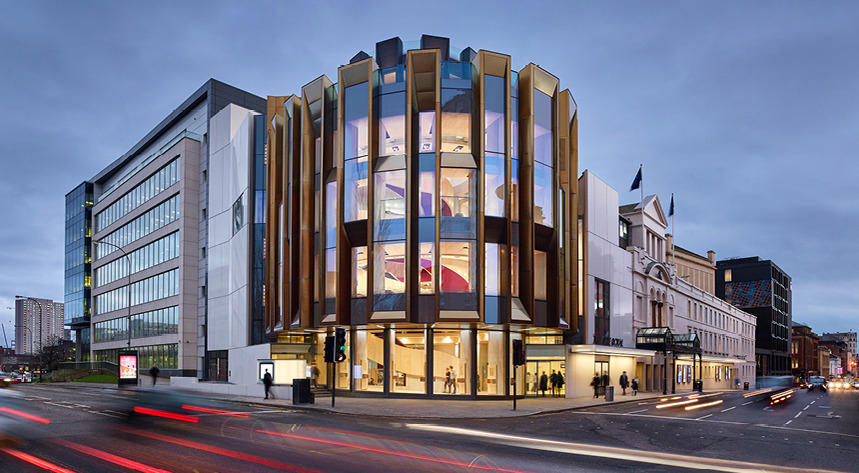 Theatre Royal Glasgow illuminated from the inside on a cloudy evening