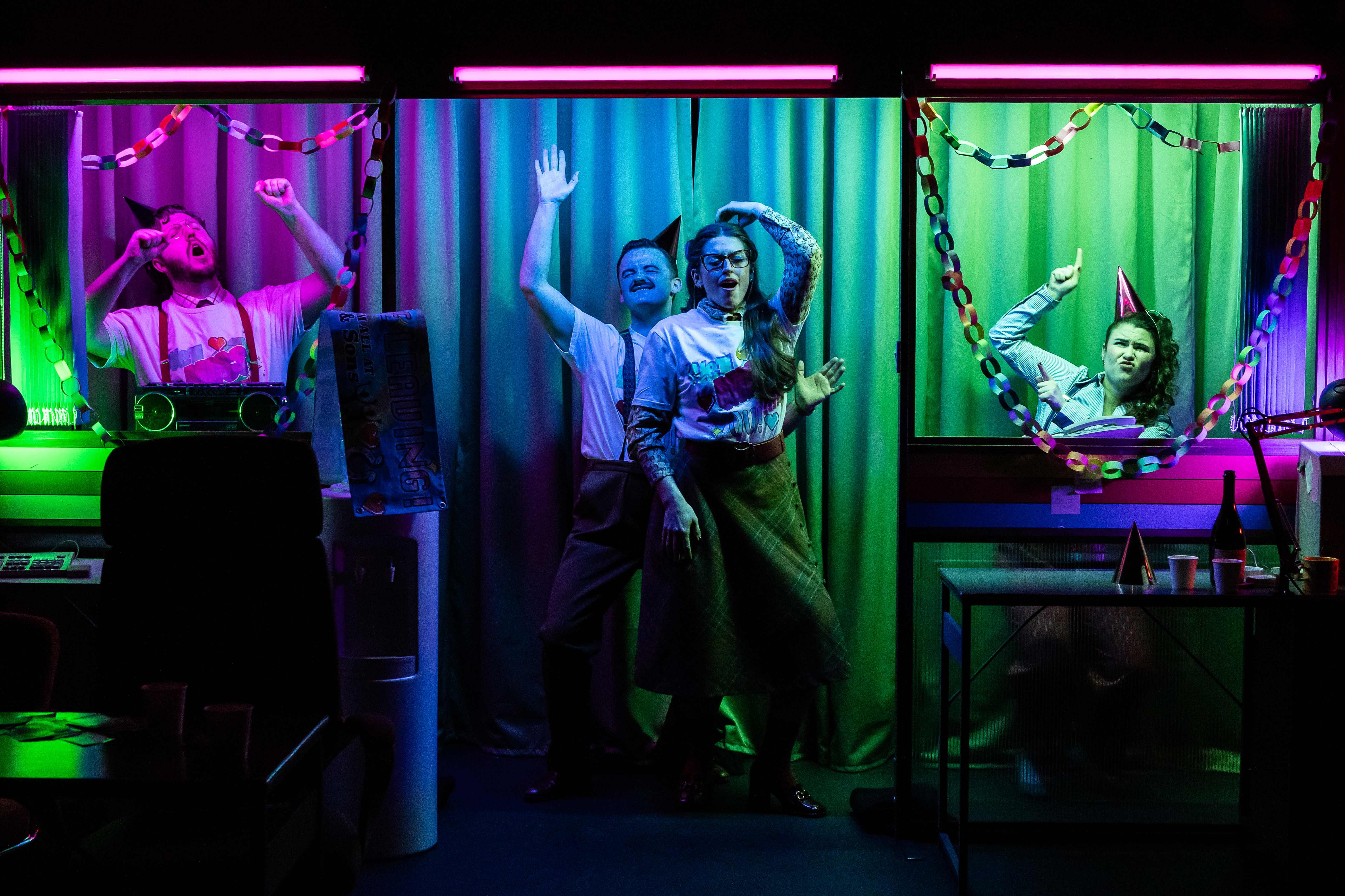 Daniel Barrett, Connor James Smith, Alexandria Moon And Kira Kaplan In The Office Party. Credit Sally Jubb..