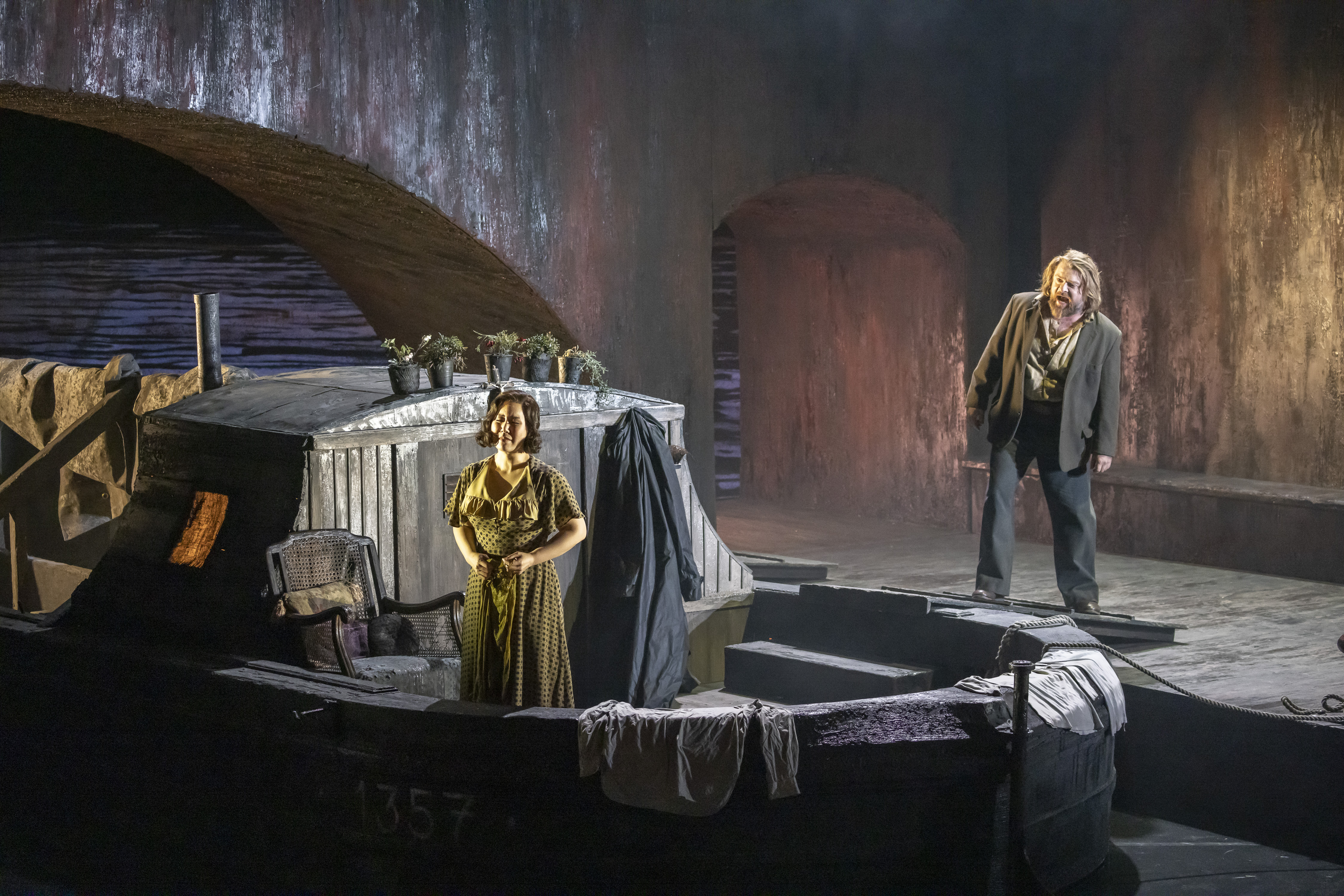 Sunyoung Seo (Giorgetta) and Viktor Antipenko (Luigi) in Il tabarro, part of Puccini's Il trittico. Scottish Opera 2023. Credit: James Glossop..