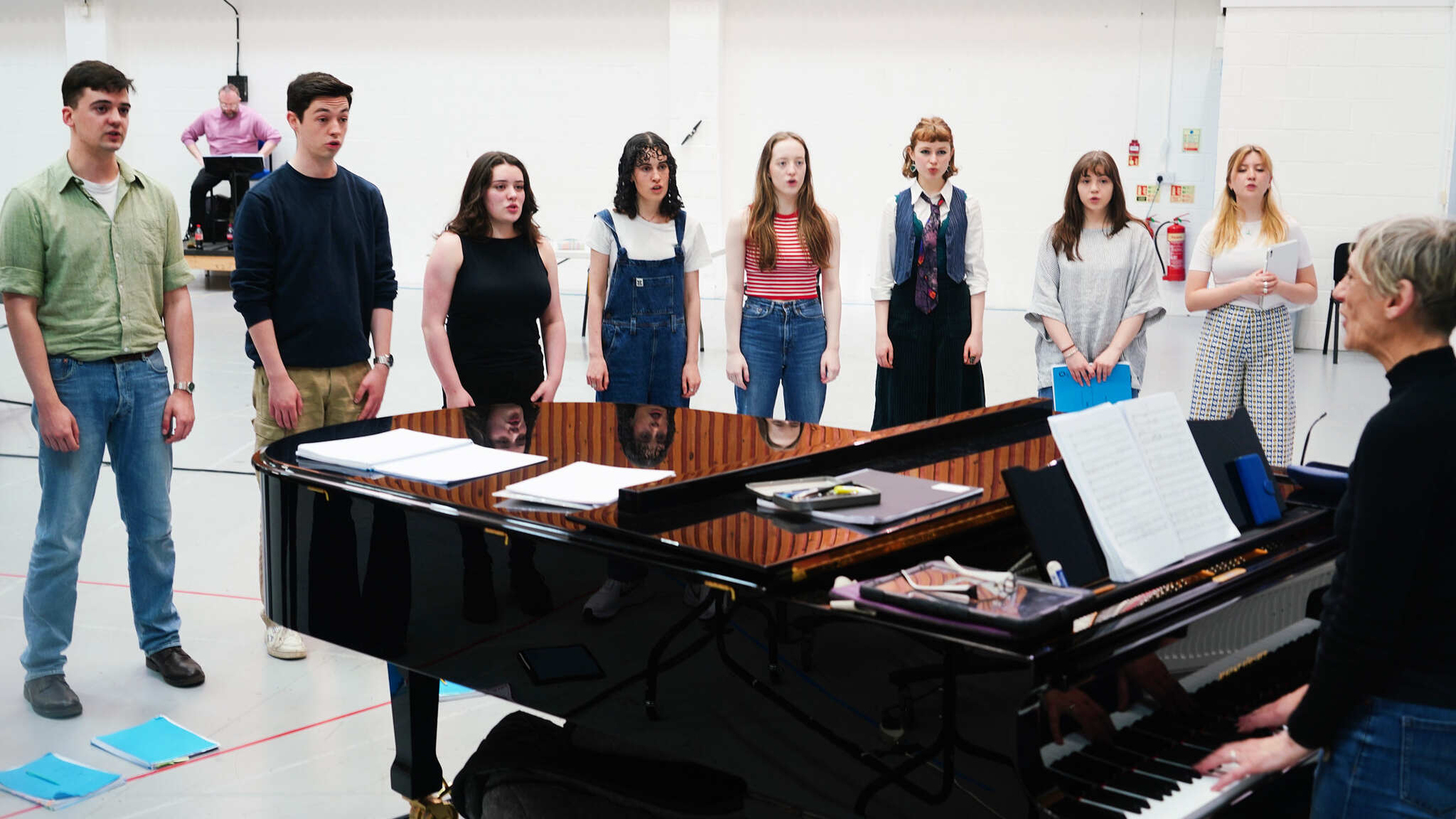 Composer Karen MacIver with Scottish Opera Young Company members during rehearsals for RED. Scottish Opera 2024. Credit Ruby Pluhar..