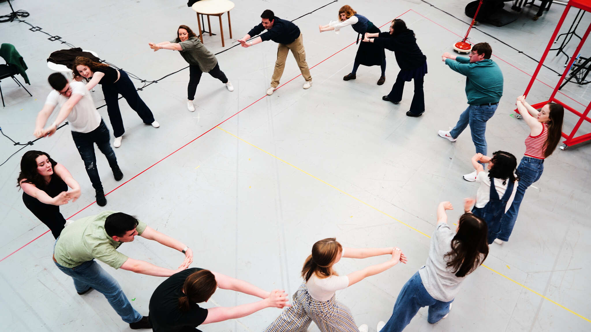 Director Flora Emily Thomson with Scottish Opera Young Company members during rehearsals for RED. Scottish Opera 2024. Credit Ruby Pluhar..